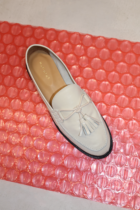 cream loafer with pompoms, top view