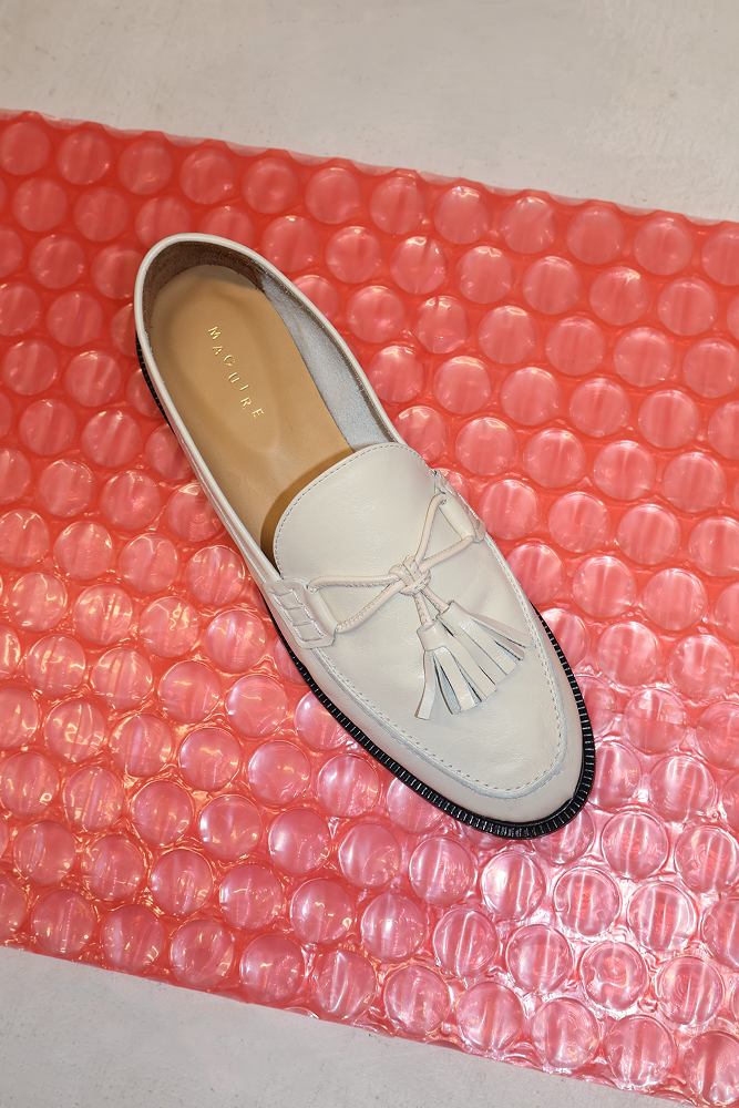 cream loafer with pompoms, top view