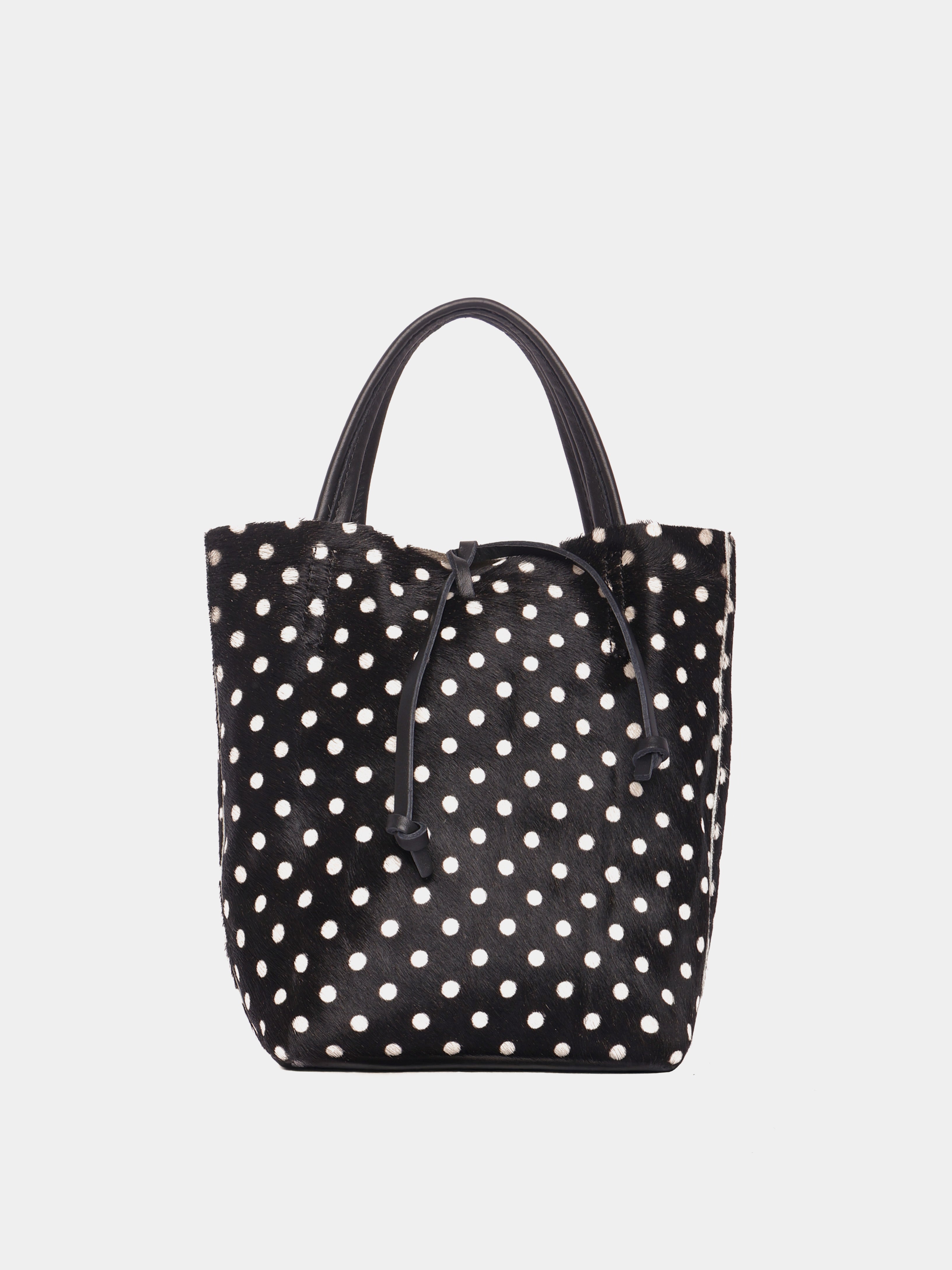 Black tote bag with white polka dots