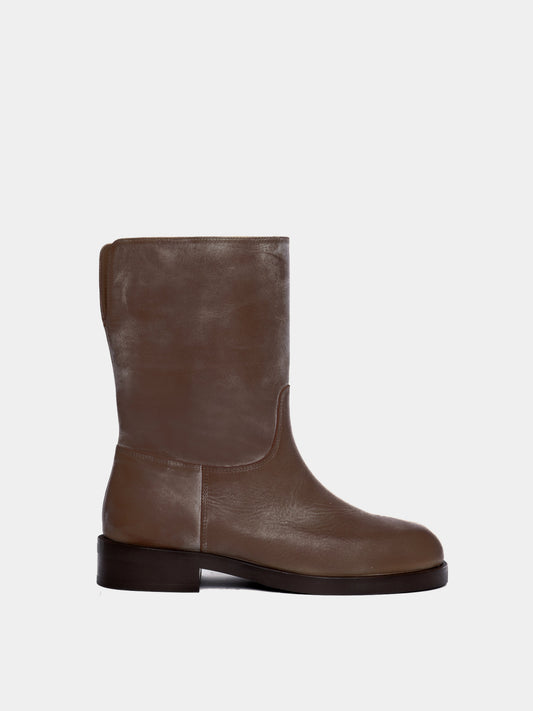 brown boot on light gray background
