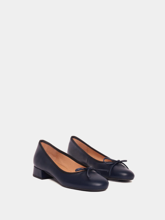 Navy leather ballerina pumps with black piping and navy bows