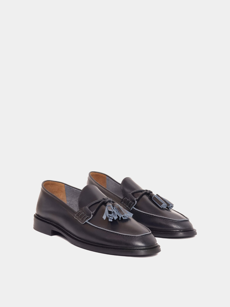Navy loafer with pompom, angle view