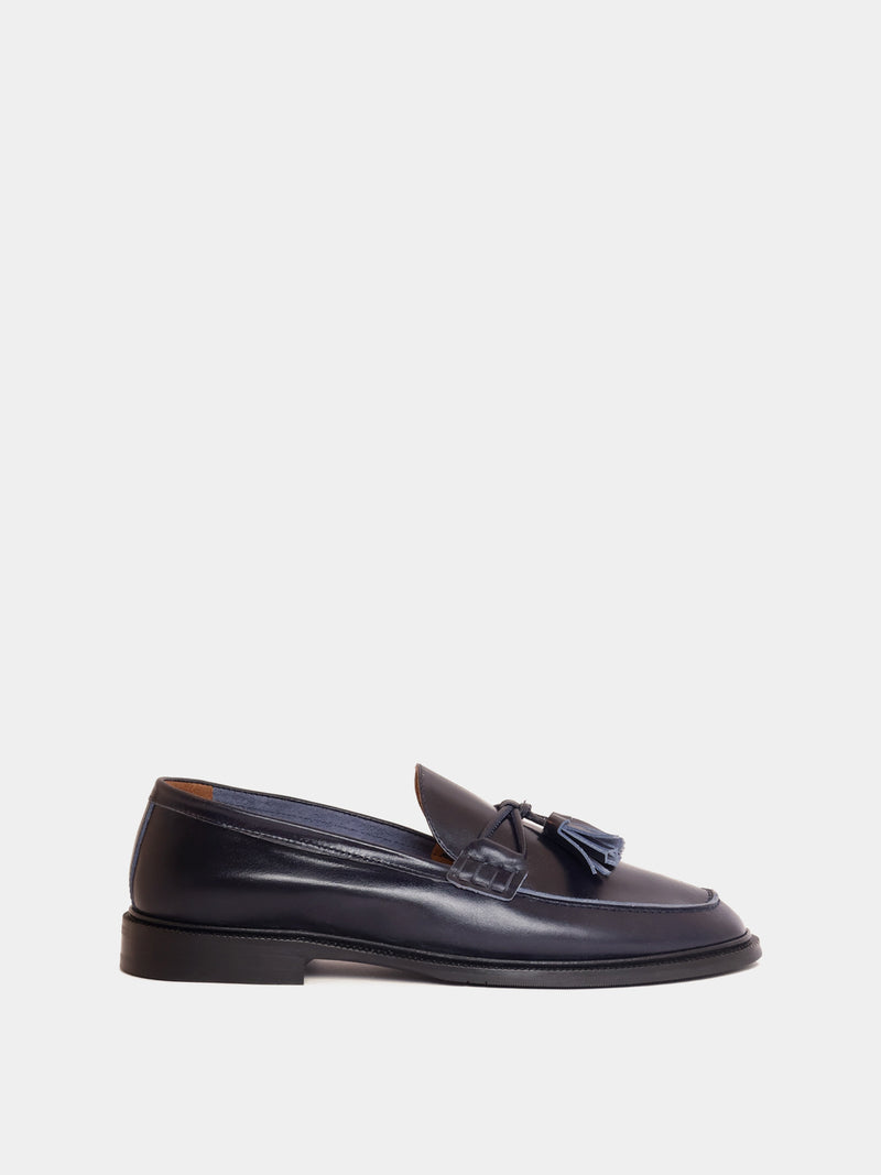 Navy loafer with pompom, side view