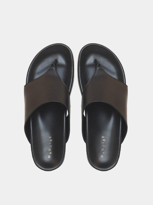 black flip flop on grey background
