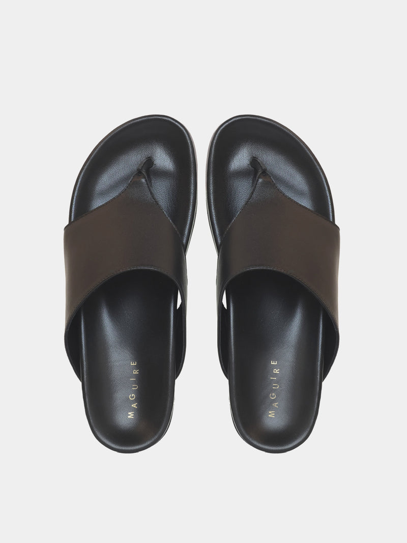 black flip flop on grey background