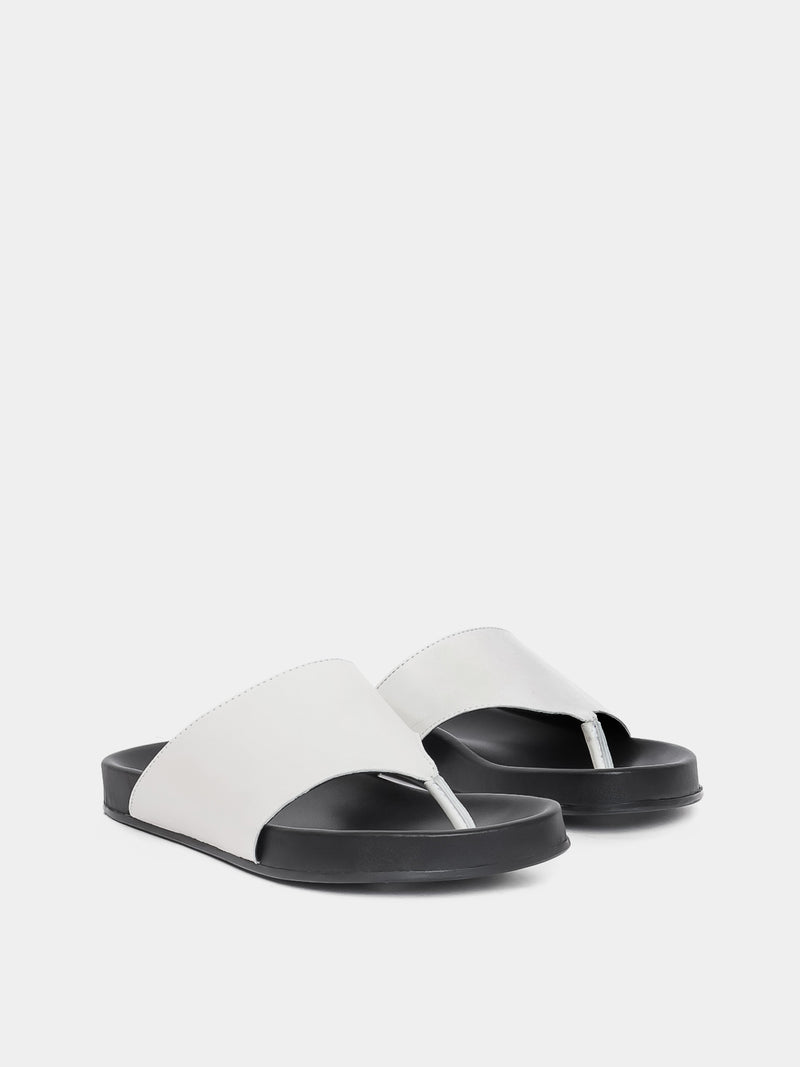 cream flip flop on grey background