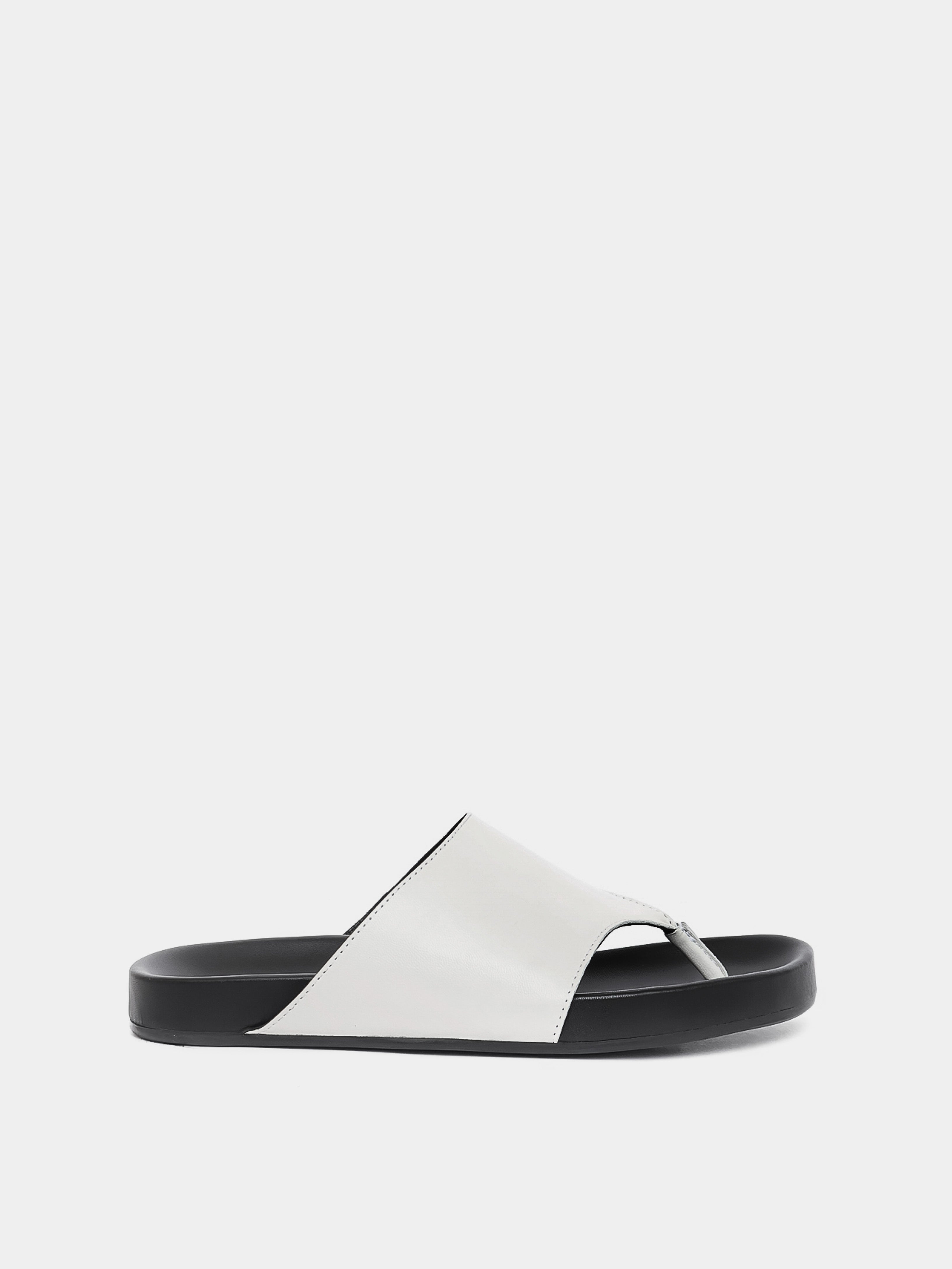 cream flip flop on grey background