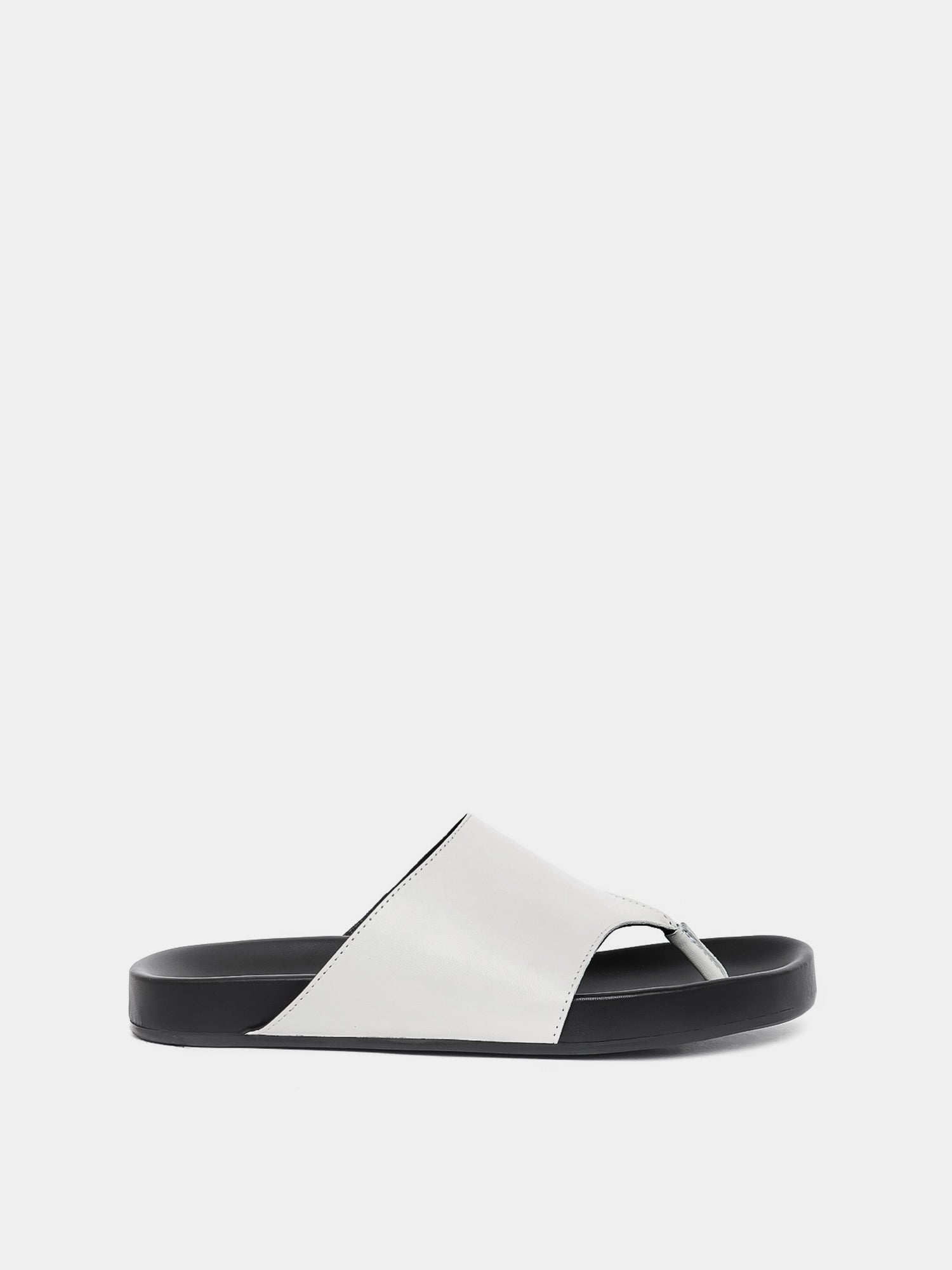 cream flip flop on grey background