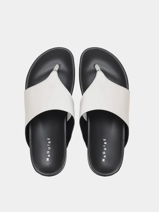 cream flip flop on grey background
