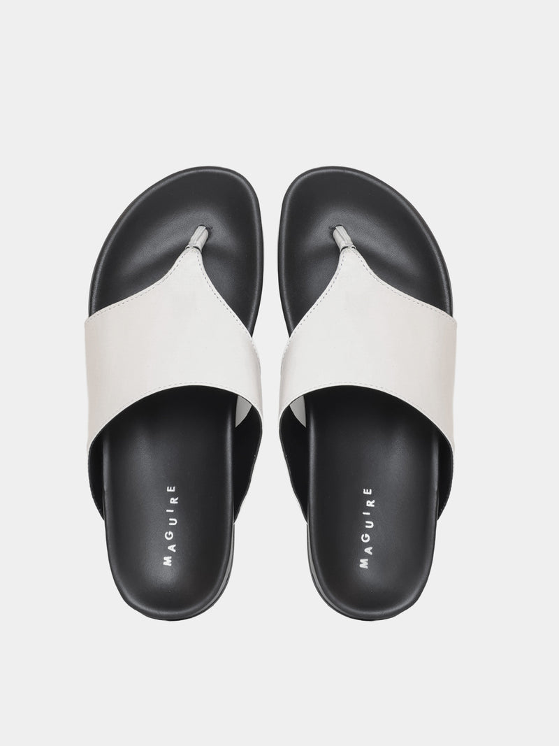 cream flip flop on grey background