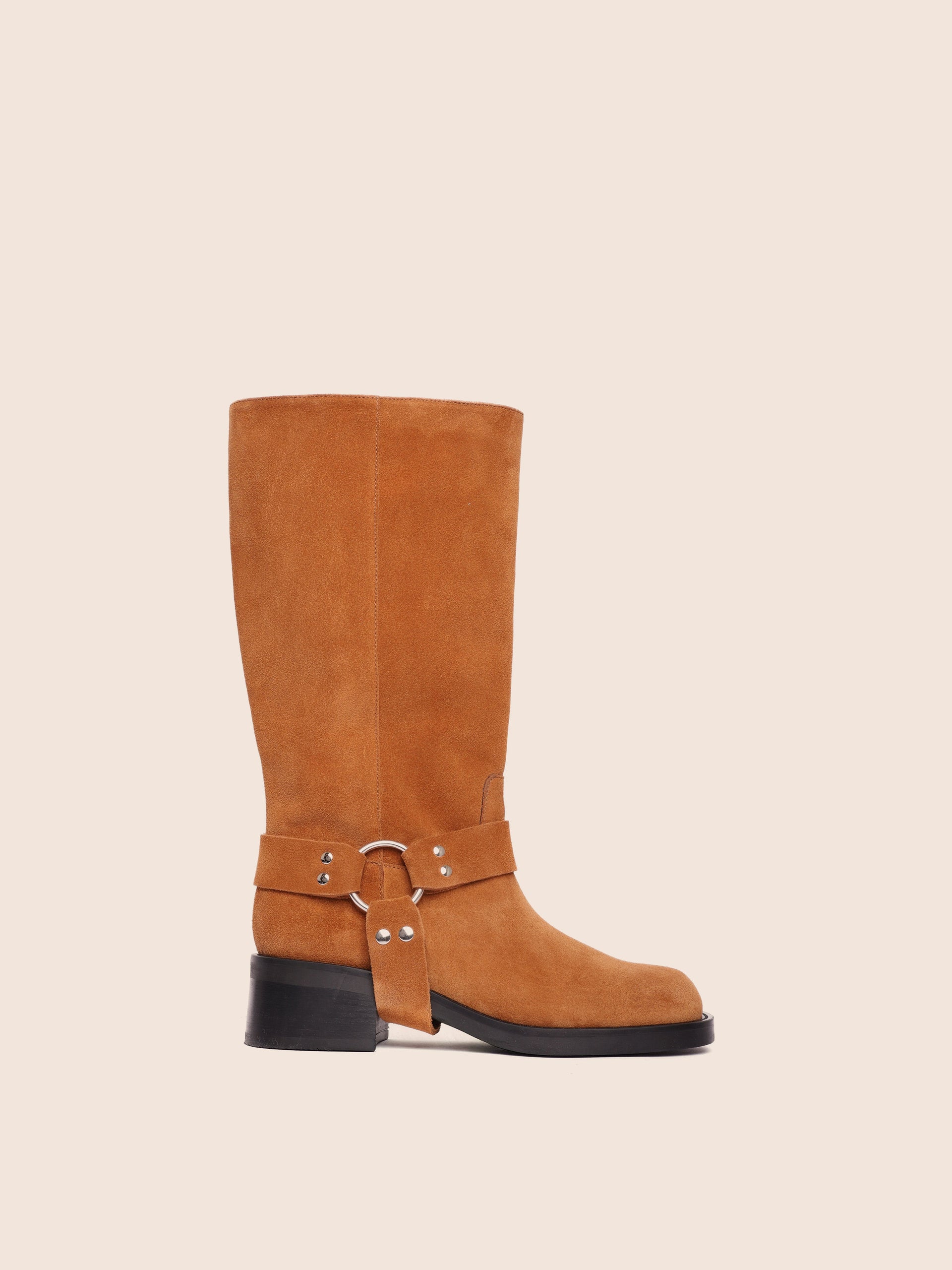 A tan suede boot with harness detailing and a mid-height heel, made in Italy.