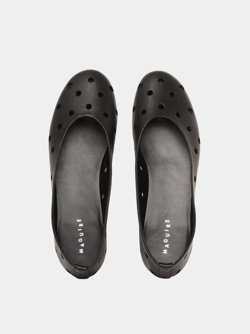 black ballet flat with round cutouts