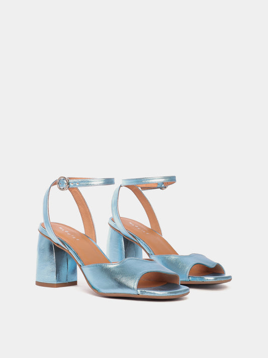 Blue metallic heels with an asymmetric wave design and adjustable ankle straps.