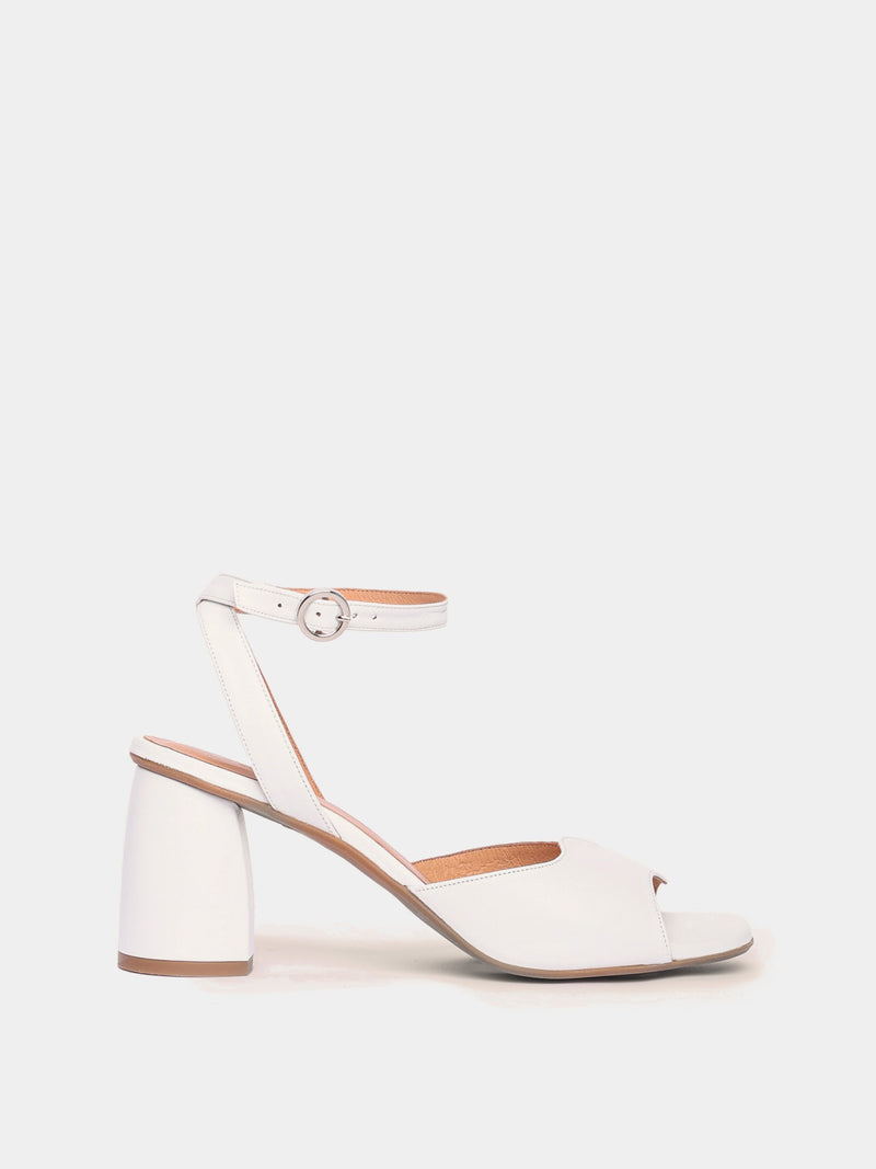 Malaga white leather heel with an asymmetric wave design and an adjustable ankle strap.