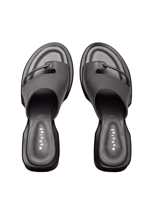 A pair of gray Mallorca slate sandals with a low heel and soft upper, placed against a plain background.