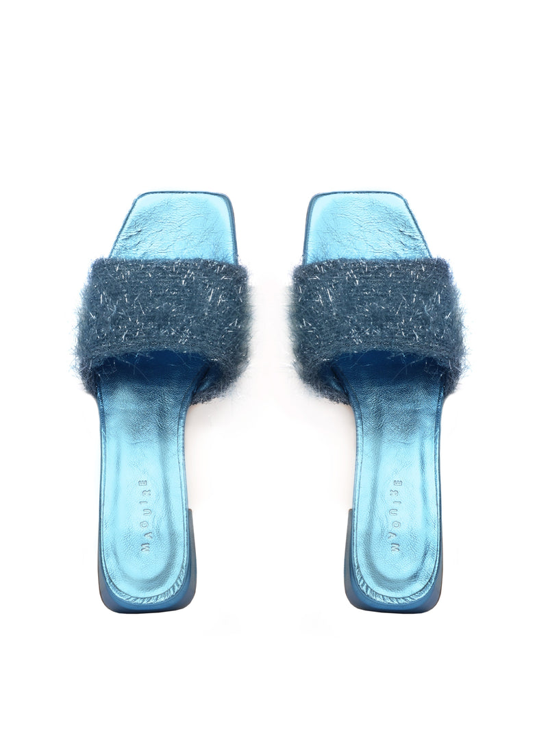 Metallic blue heels with a fuzzy band