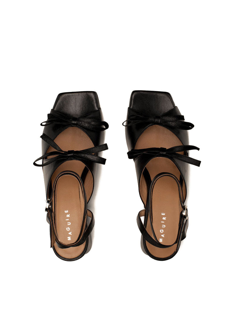 Mira black leather square-toe heel with ankle strap and two bows, top view.