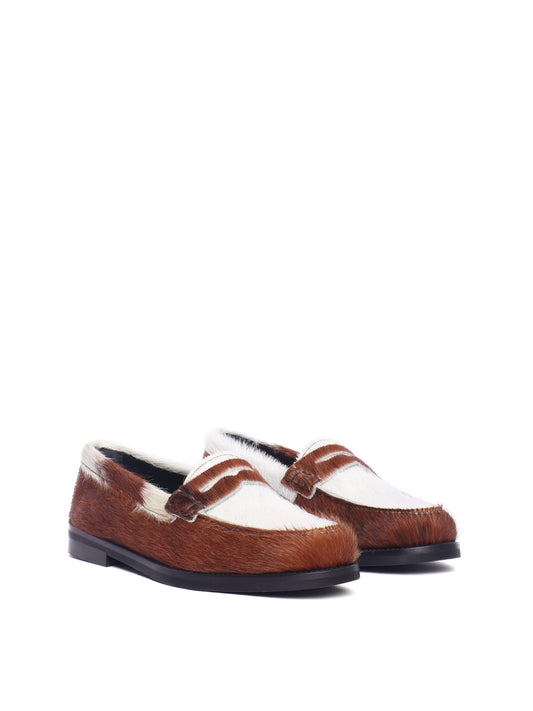Napoli loafer with cow-print pony hair and black sole, front view.