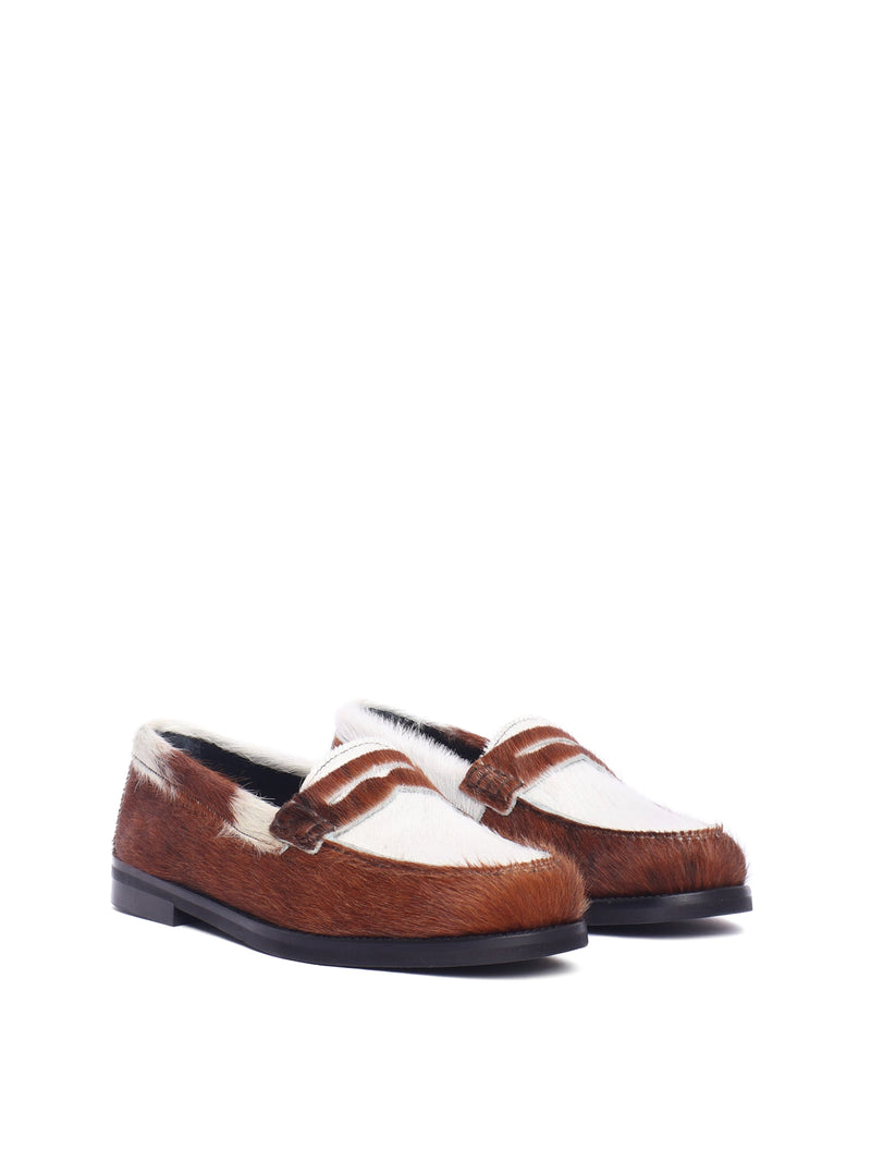 Napoli loafer with cow-print pony hair and black sole, front view.