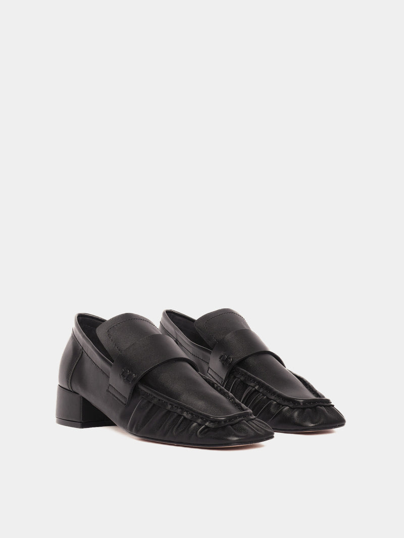 Black leather loafers with a small heel