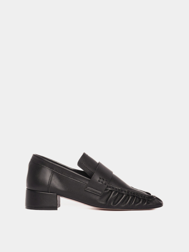 Black leather loafers with a small heel