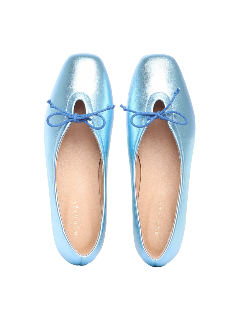 Ice blue metallic leather ballerina flats with a blue bow
