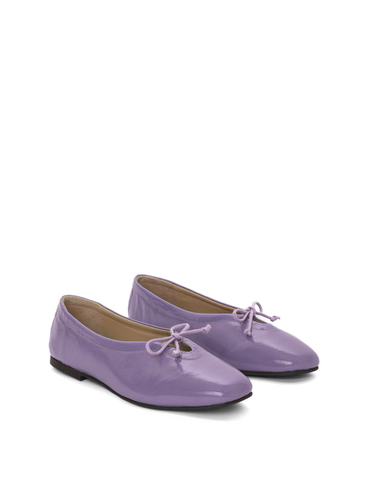 Violet patent leather ballerina flats with a lilac bow