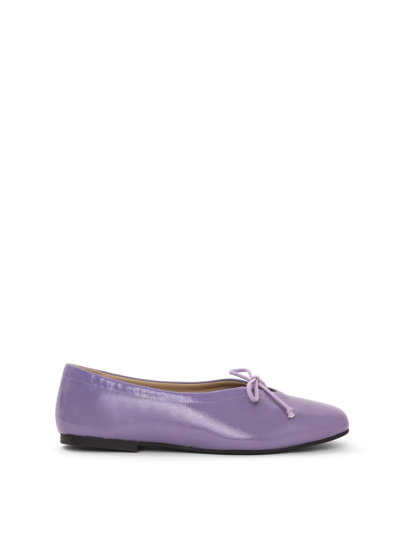 Violet patent leather ballerina flat with a lilac bow