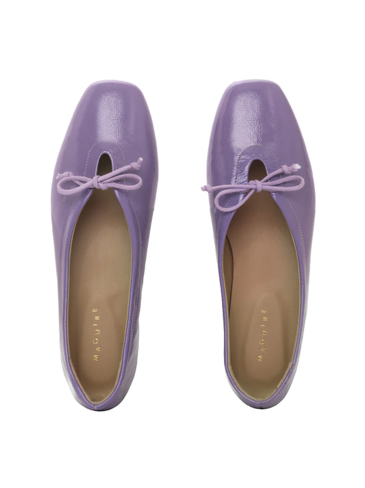 Violet patent leather ballerina flats with a lilac bow