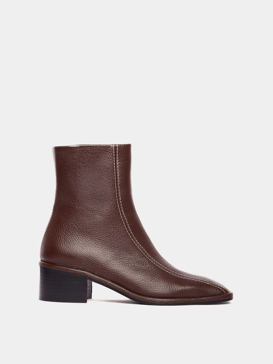 Brown leather ankle boot with white contrast stitching and a block heel