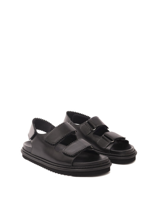 Tavira black leather sandal with two adjustable front straps and one back strap, front view.