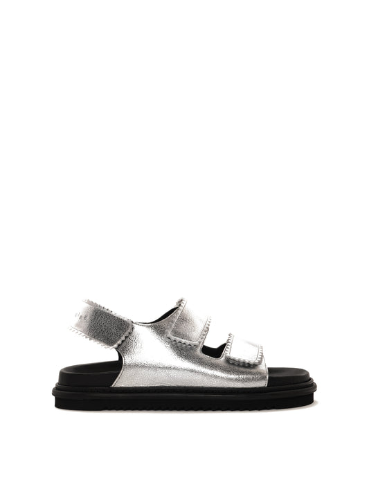 Tavira silver leather sandal with two adjustable front straps and one back strap, side view.