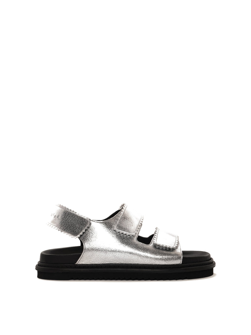 Tavira silver leather sandal with two adjustable front straps and one back strap, side view.