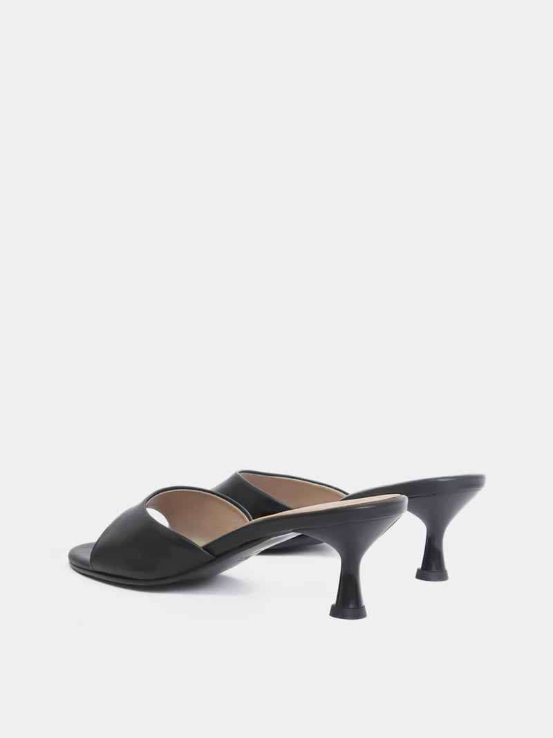Back view of black open toe heeled sandal on white background