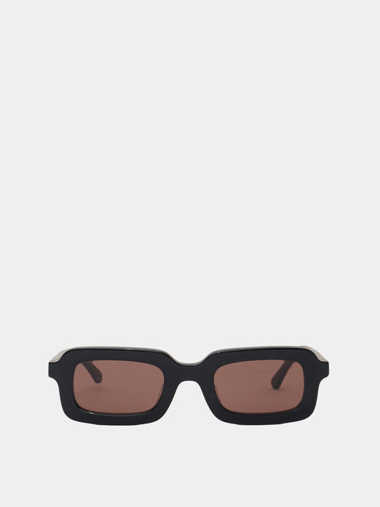 Rectangle shaped sunglasses in a black plastic colour with a brown lens. 