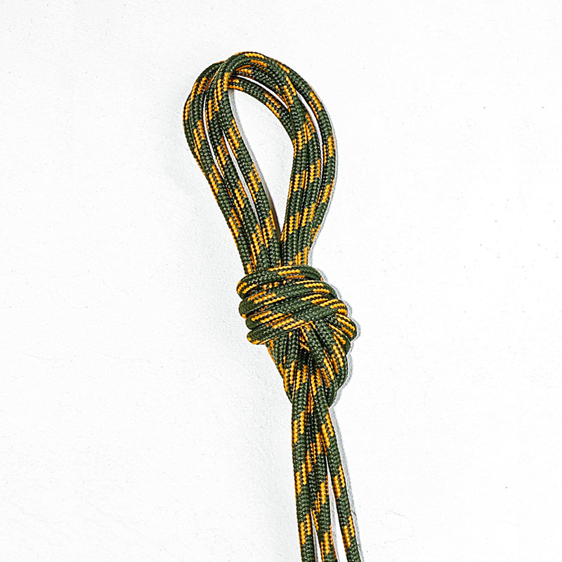 Green and orange laces with a knot on a white background