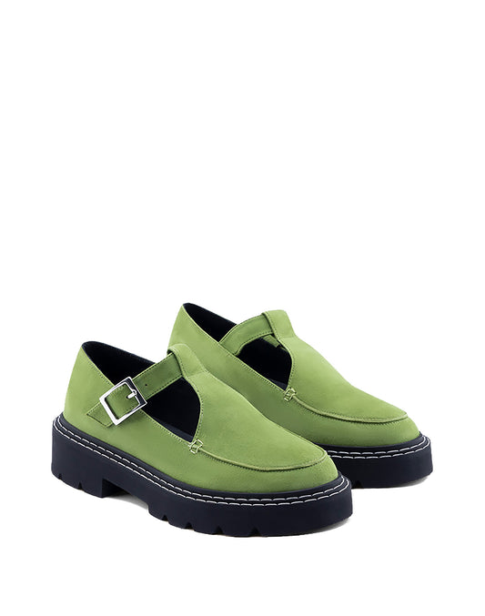 Green Mary Jane with black soles on a white background