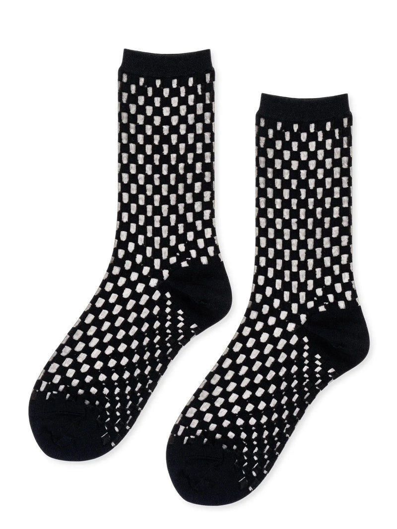 Black socks with white geometric pattern on a white background